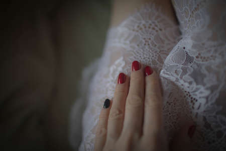 Beautiful large white lace on the nightgown. Close up.の写真素材