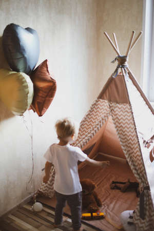 Childrens wigwam for a beige boy. In the nursery.の写真素材