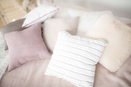 Small square pillows on the sofa. Close up.の写真素材