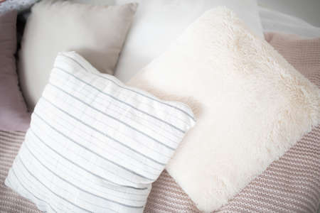 Small square pillows on the sofa. Close up.の写真素材