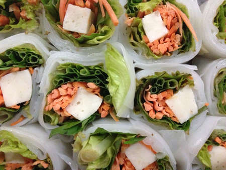Lettuce and basil roll with fish cake wrapped with rice flour pieces. Bought from a street vendor in...