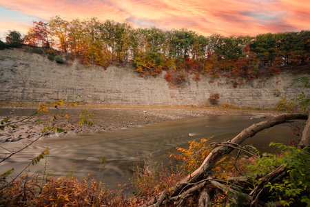 Long Exposure River at Sunset with Shale Cliffの写真素材