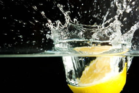 lemon and water bubbles on a black backgroundの写真素材