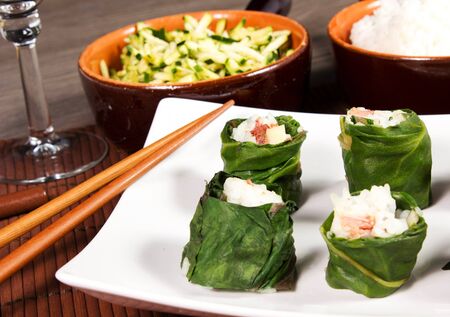 sushi meat on the table with zucchini and riceの写真素材