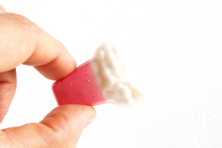 candy in the hand on a white backgroundの写真素材