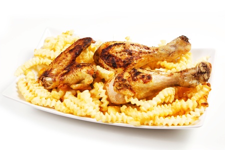 baked chicken with french fries on a white backgroundの写真素材