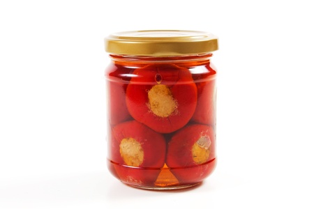 chillies in oil on a white backgroundの写真素材