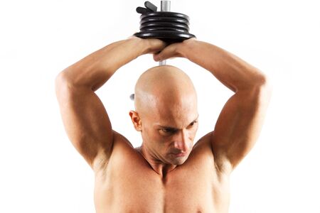 tattooed man who does gym on a white backgroundの写真素材