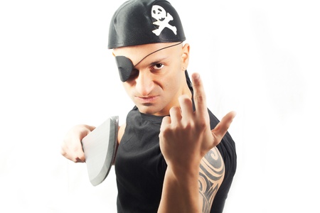 Young man in a pirate costume with pistol  Isolated on whiteの写真素材