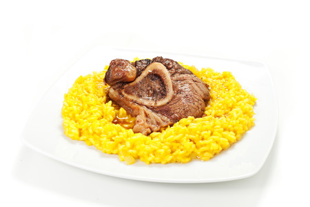rice with saffron and bovine meat on a white backgroundの写真素材
