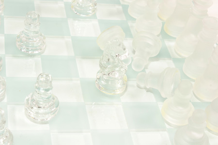 transparent glass chess isolated on whiteの写真素材