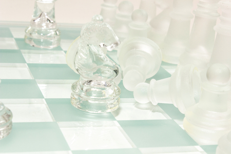 transparent glass chess isolated on whiteの写真素材