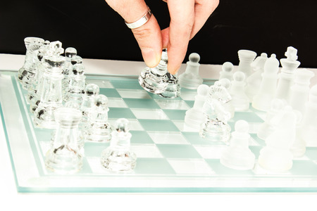 transparent glass chess isolated on whiteの写真素材