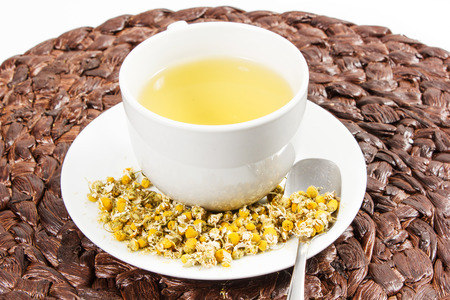 Chamomile tea with chamomile flower on the white backgroundの写真素材