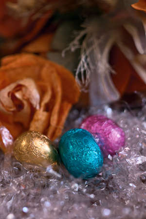 three colored chocolate eggs の写真素材