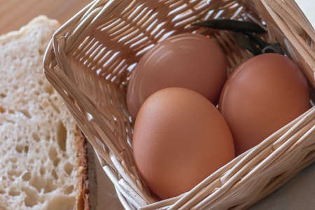 Photograph depicting eggs in the basket and sliced bread