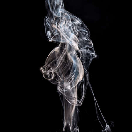 Illuminated smoke that propagates on a black backgroundの写真素材
