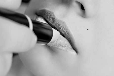 First floor of a girl who puts the lipstickの写真素材