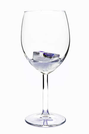 ice in glass on white backgroundの写真素材
