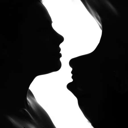 profile of two girls in black and whiteの写真素材