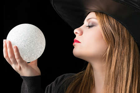 blond witch with magic ballの写真素材
