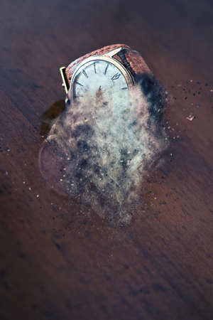 old wrist watch on a wooden base