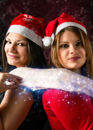 two girls with scarf Christmasの写真素材