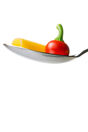 red hot pepper and pasta on spoonの写真素材