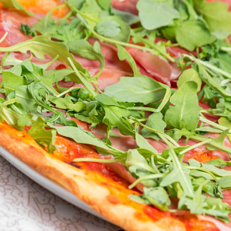 italian pizza with rocket saladの写真素材