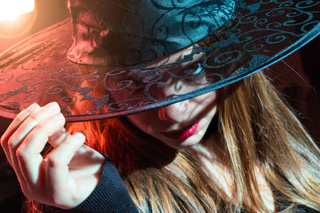 blond witch with lace hatの写真素材