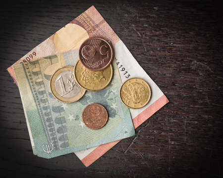 Money euro on a wooden baseの写真素材