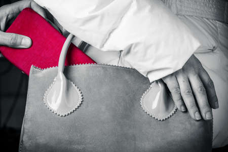 red stealing wallets in black and whiteの写真素材