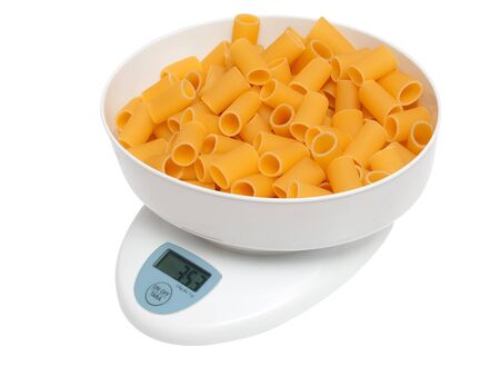 kitchen scale to be weighed with pastaの写真素材