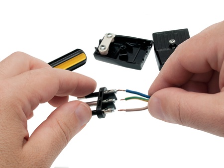 electrician connects plug and wire
