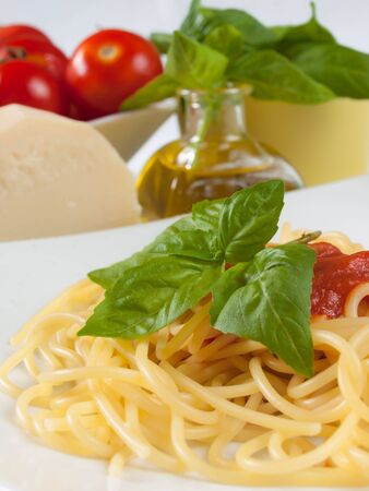 spaghetti with tomato, oil and basilの写真素材