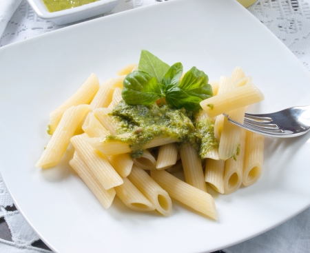 Pasta with pesto sauce and nutsの写真素材