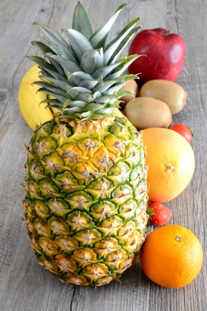 various fresh colored  fruit on wooden tableの写真素材