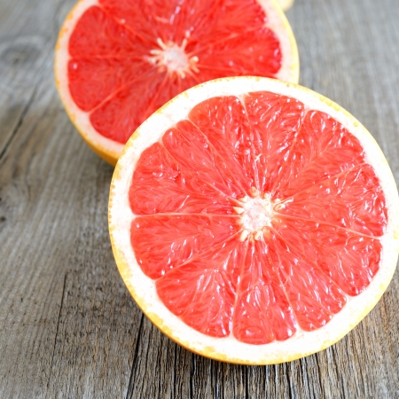 various fresh colored  fruit on wooden tableの写真素材