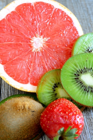 various fresh colored  fruit on wooden tableの写真素材