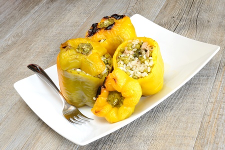 peppers stuffed with rice, sausage, peas and bakedの写真素材