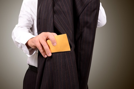 business man hands him an envelope for corruptionの写真素材