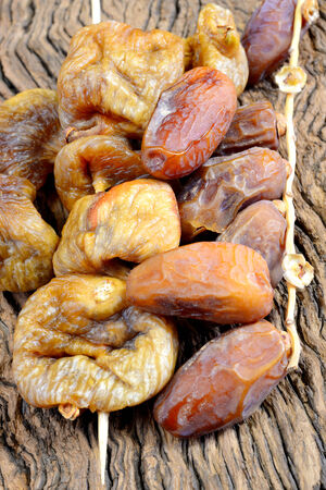 Christmas sweet exotic dried fruits, dates, prunes and apricots and figsの写真素材