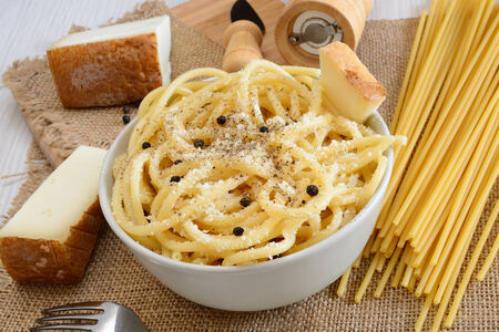 italian pasta bucatini with pecorino cheese and black pepperの写真素材