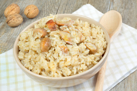risotto with porcini mushrooms on wooden tableの写真素材