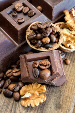 chocolate and walnuts on old wood backgroundの写真素材