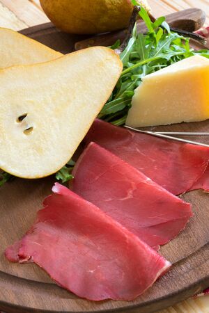bresaola seasoned with olive oil, rocket and parmesan flakesの写真素材