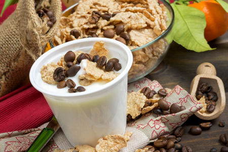 low-fat plain yogurt creamy with crispy cereals and coffee beansの写真素材