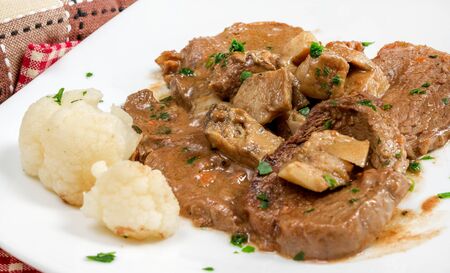 scallops of veal with porcini mushroom sauce and parsleyの写真素材