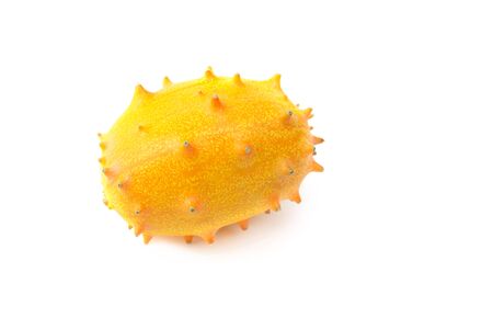 fresh yellow kiwano fruit on white backgroundの写真素材