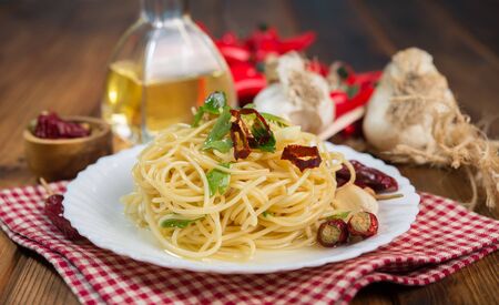 Spaghetti garlic oil and chili pepper, typical Italian specialtyの写真素材